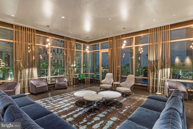 living room featuring ornamental molding and dark hardwood / wood-style flooring