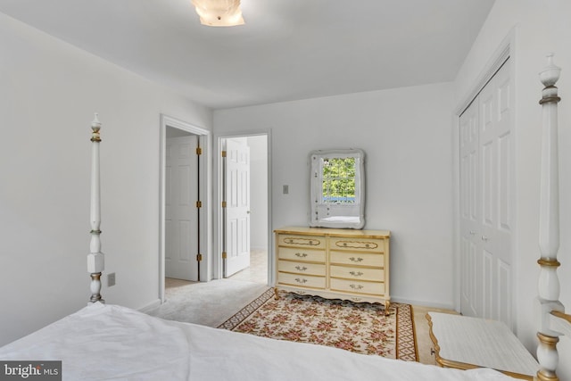 carpeted bedroom with a closet