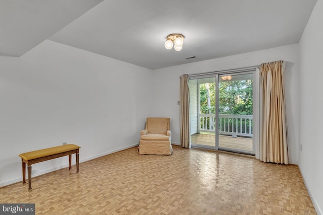 sitting room with light parquet flooring