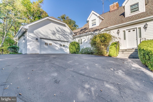 view of home's exterior with a garage