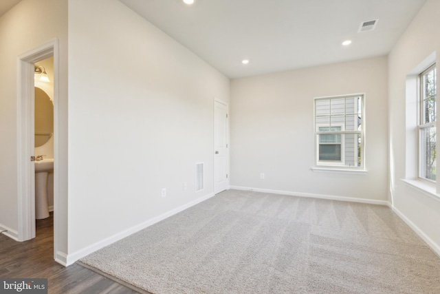 spare room with dark wood-type flooring