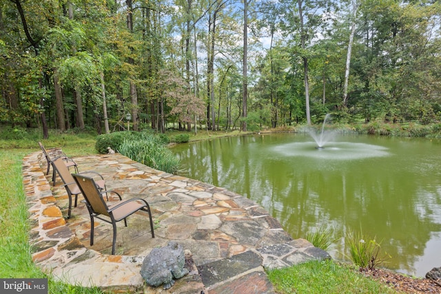 view of patio featuring a water view