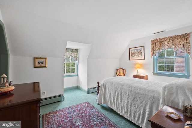 bedroom featuring multiple windows, vaulted ceiling, and a baseboard heating unit