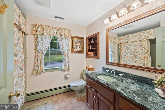 bathroom featuring vanity, baseboard heating, tile patterned flooring, and toilet