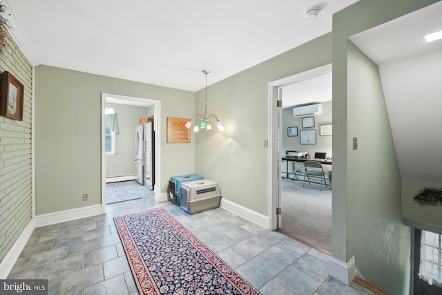 interior space with a notable chandelier, a wall mounted air conditioner, and a baseboard heating unit