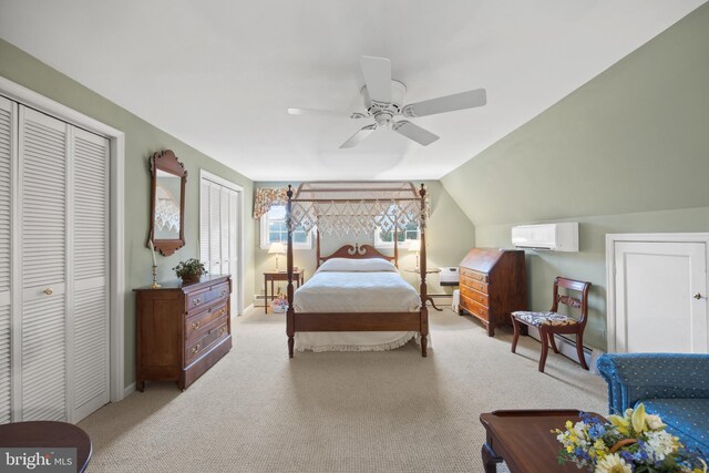 carpeted bedroom featuring lofted ceiling, an AC wall unit, and ceiling fan