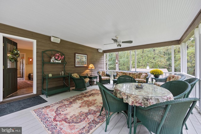 sunroom / solarium with ceiling fan and a wealth of natural light