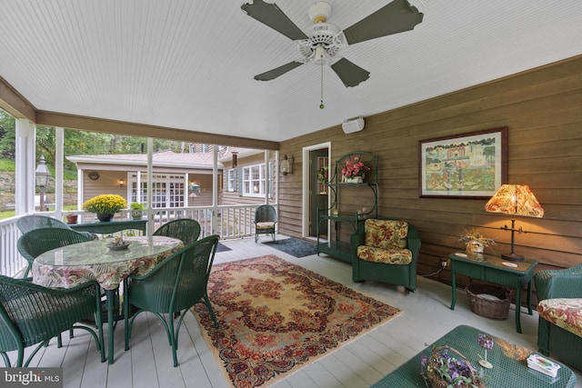 sunroom with a wealth of natural light and ceiling fan