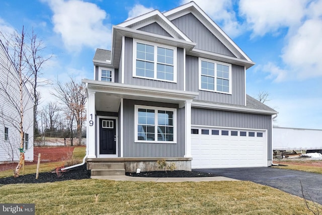 view of front facade with a front lawn and a garage