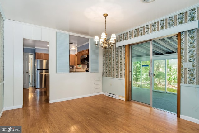 unfurnished dining area featuring an inviting chandelier, a baseboard radiator, ornamental molding, and light wood-type flooring