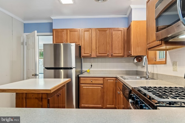 kitchen featuring ornamental molding, decorative backsplash, stainless steel appliances, and sink