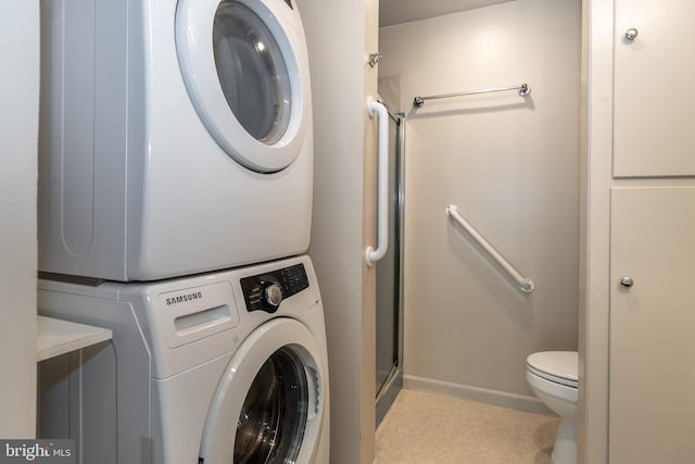 washroom with stacked washer / dryer