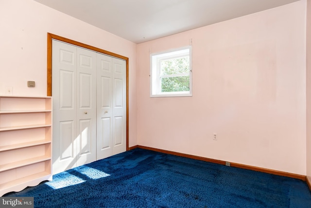 unfurnished bedroom with carpet floors