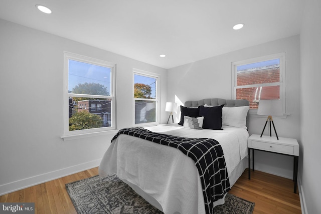 bedroom with hardwood / wood-style floors