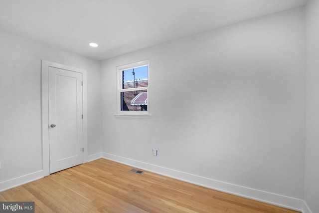 empty room featuring wood-type flooring