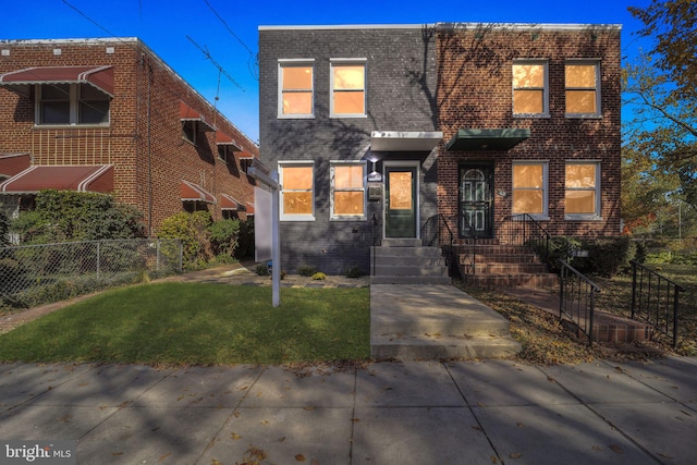 view of front facade with a front yard