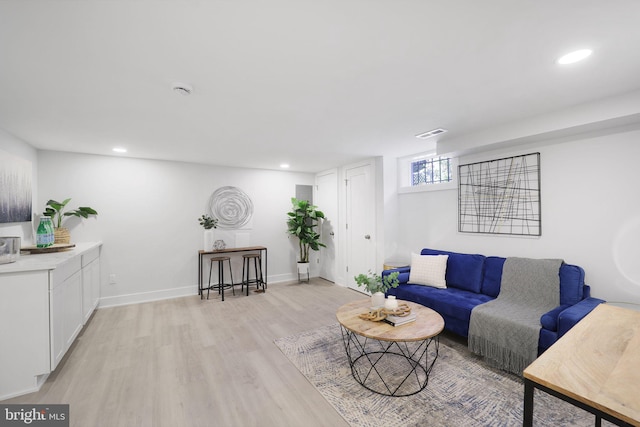 living room with light hardwood / wood-style floors