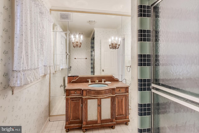 bathroom featuring tile patterned flooring, visible vents, wallpapered walls, an inviting chandelier, and vanity