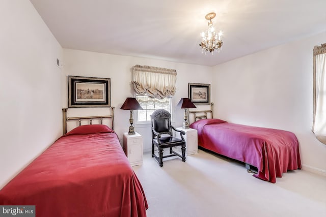 bedroom featuring an inviting chandelier and carpet flooring