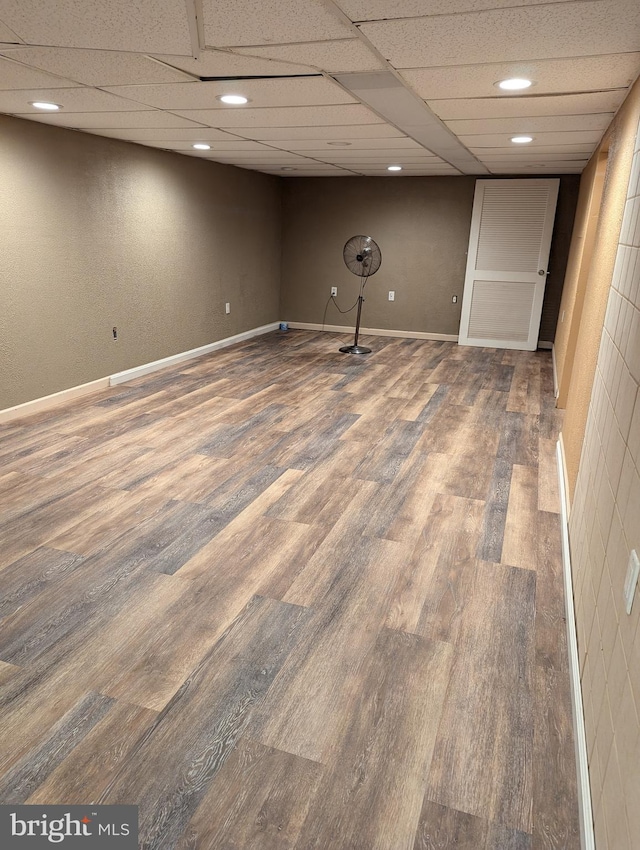 finished basement featuring wood finished floors, baseboards, and recessed lighting