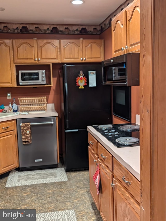kitchen with brown cabinets, light countertops, black appliances, and recessed lighting