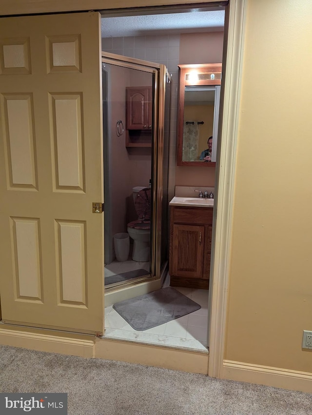 full bath with vanity and a stall shower