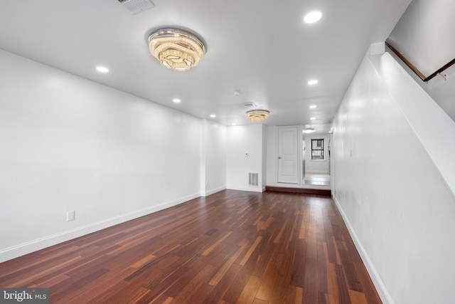 unfurnished living room featuring dark hardwood / wood-style flooring