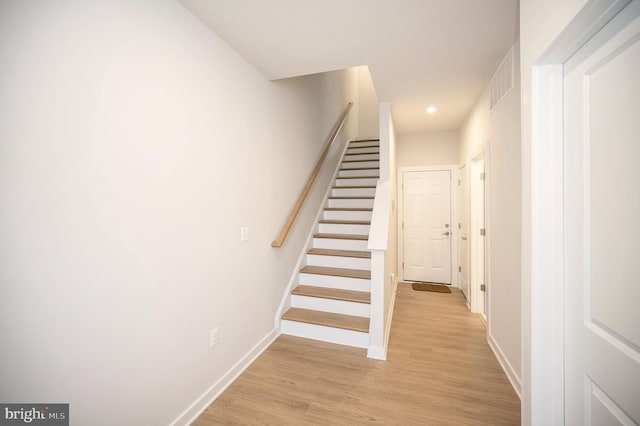 staircase featuring hardwood / wood-style floors