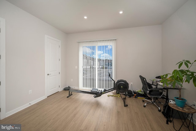 exercise area featuring light hardwood / wood-style flooring