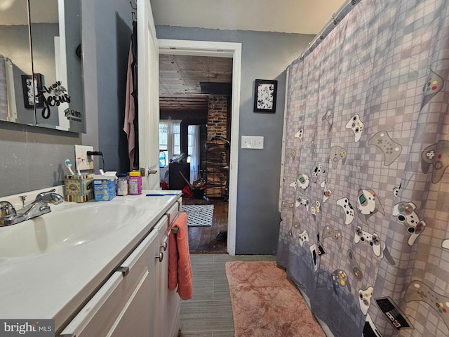 bathroom featuring vanity and wood-type flooring