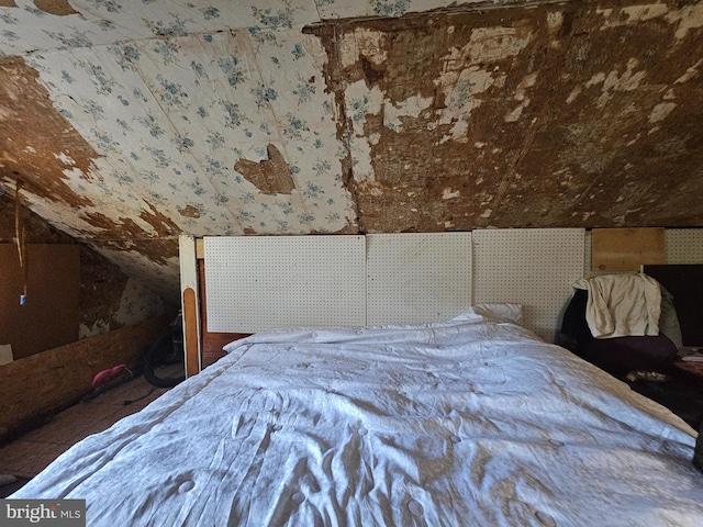 bedroom featuring lofted ceiling