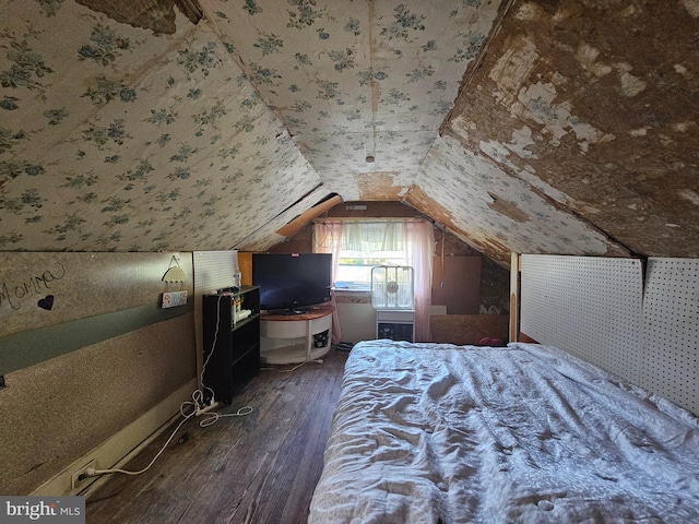 bedroom with lofted ceiling and dark wood-type flooring