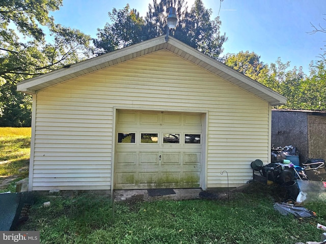 garage featuring wood walls