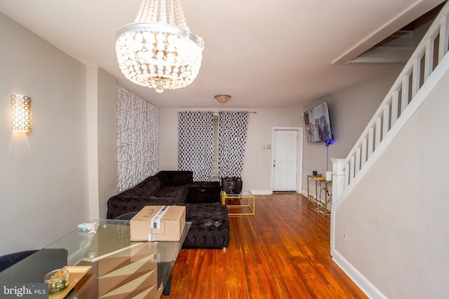 interior space with an inviting chandelier and dark hardwood / wood-style flooring