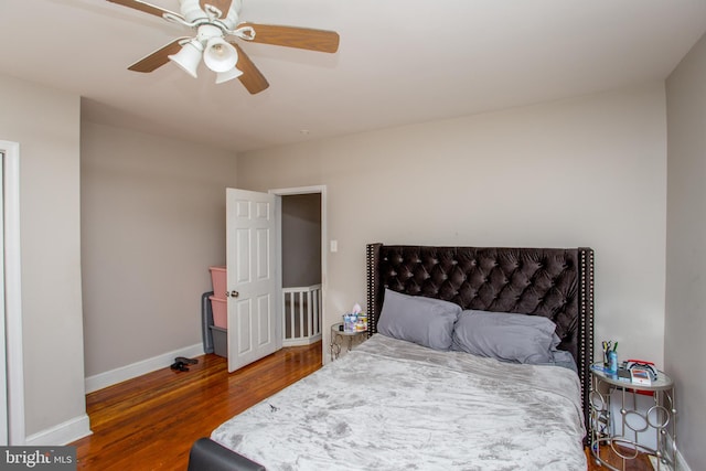 bedroom featuring ceiling fan and hardwood / wood-style floors