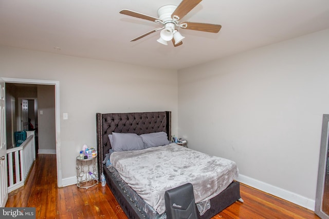 bedroom featuring ceiling fan and dark wood-type flooring