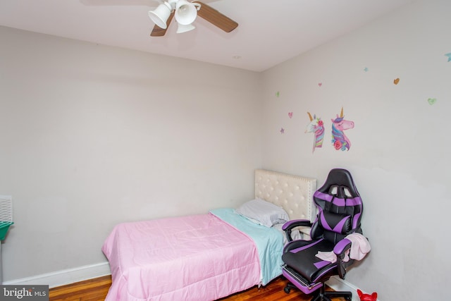 bedroom featuring wood-type flooring and ceiling fan