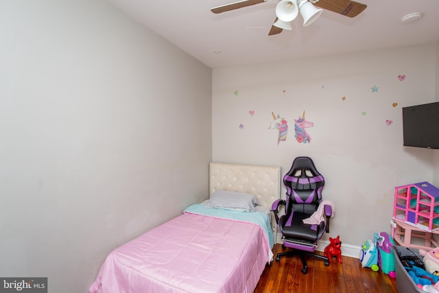 bedroom with wood-type flooring and ceiling fan