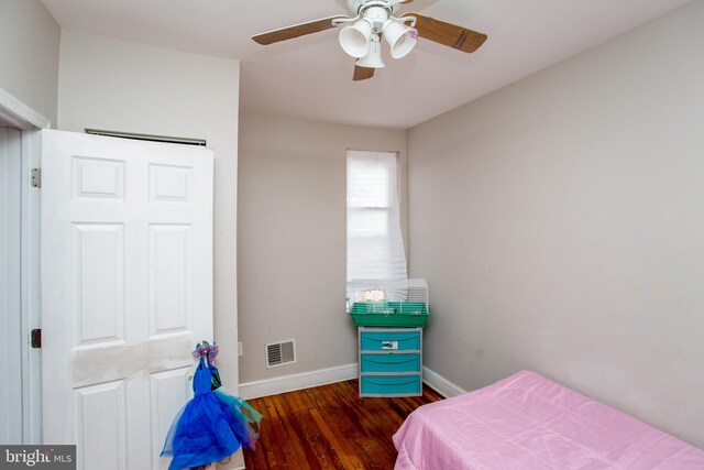 bedroom featuring dark hardwood / wood-style flooring and ceiling fan