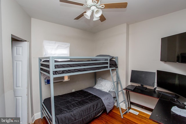 bedroom featuring ceiling fan and wood-type flooring