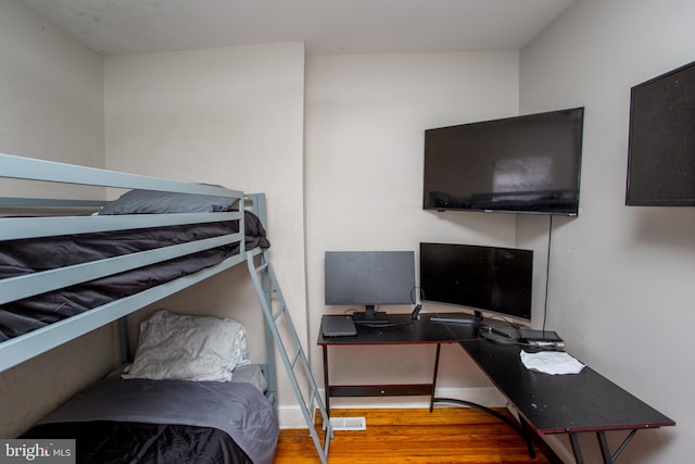 bedroom featuring hardwood / wood-style flooring