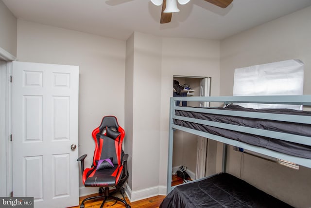 bedroom with hardwood / wood-style floors and ceiling fan