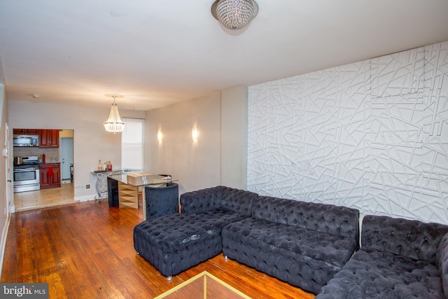 living room with tile walls and dark wood-type flooring