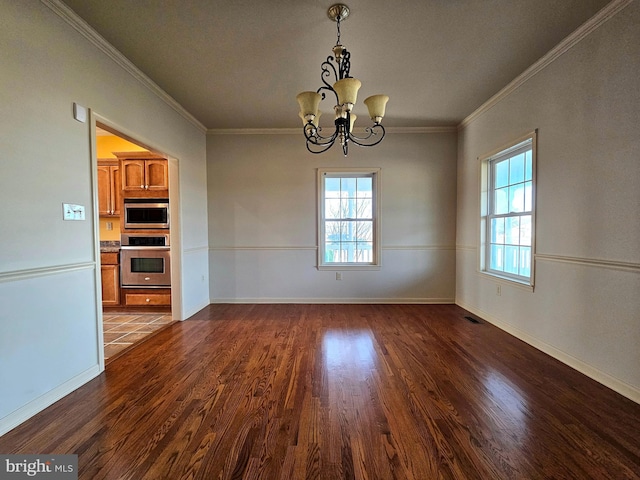 interior space with a chandelier, dark hardwood / wood-style floors, and crown molding