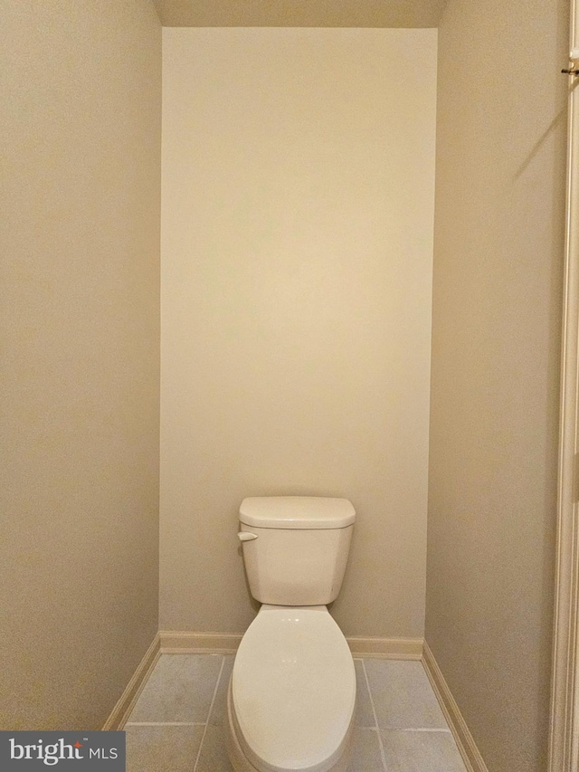 bathroom featuring tile patterned flooring and toilet