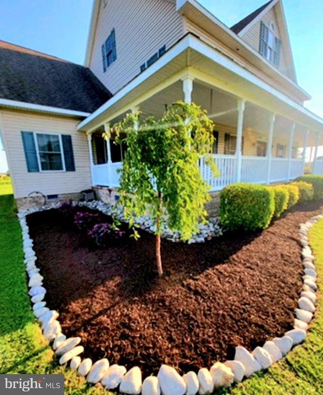 view of property exterior with a porch