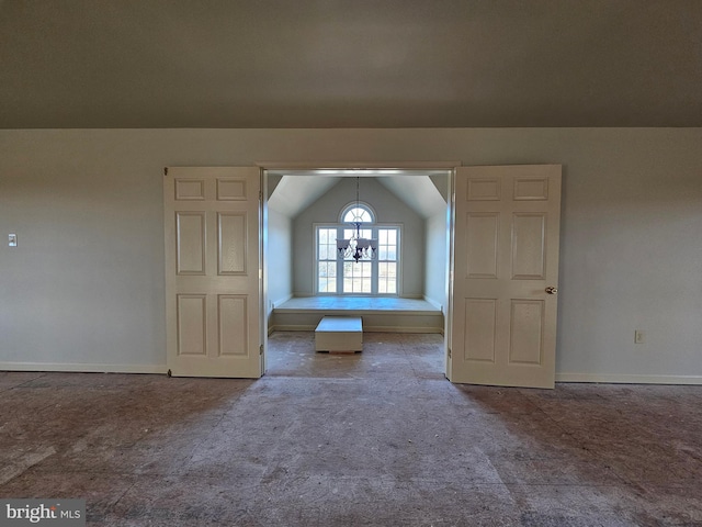 additional living space featuring a notable chandelier, lofted ceiling, and carpet floors