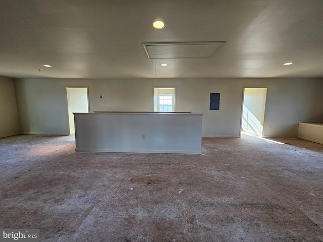 carpeted spare room with electric panel