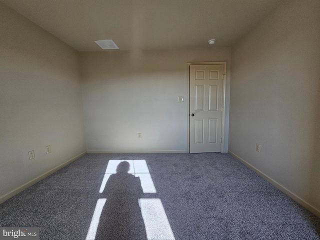 empty room with carpet flooring