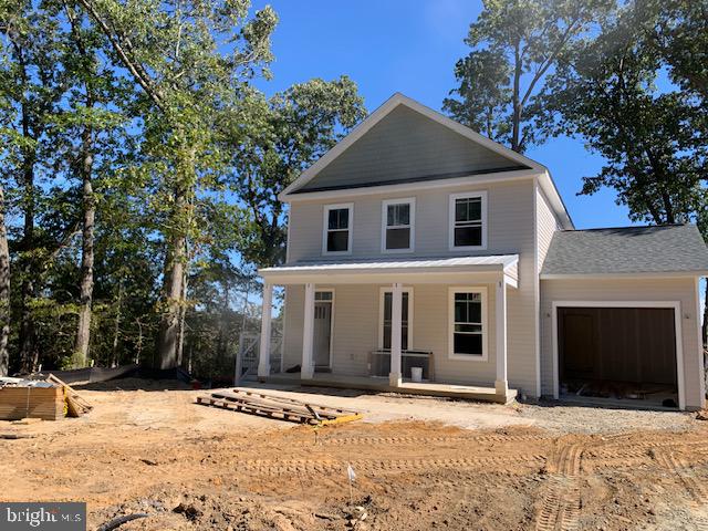 view of front facade featuring a garage and covered porch